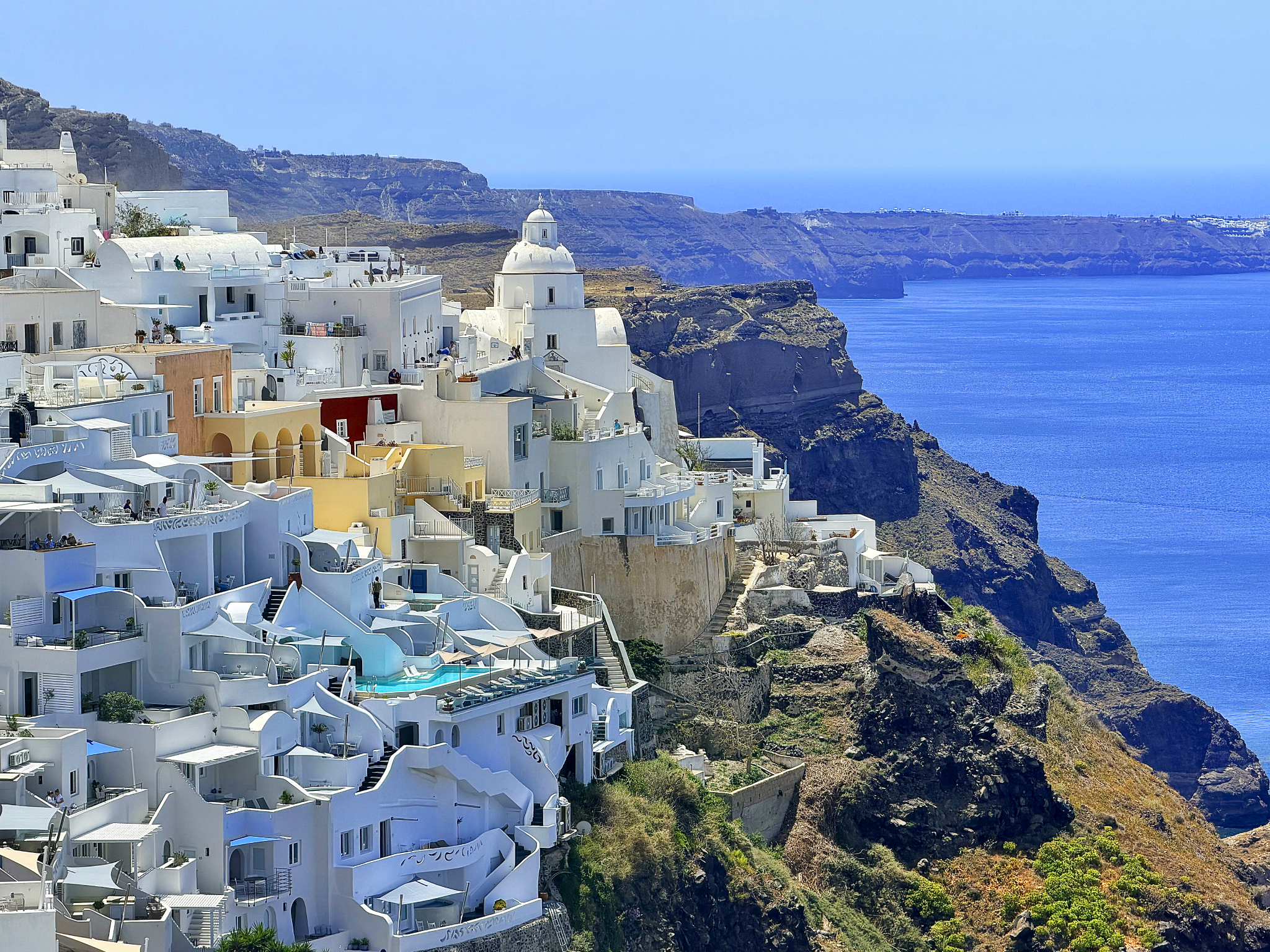 Cycladic architecture of Fira cascading down the cliffside Cycladic architecture of Fira cascading down the cliffside